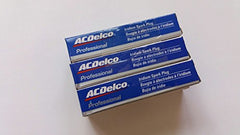 ACDelco six-pack laid out on workbench ready for multi-cylinder replacement