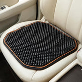 Acshio front view of wood beaded cushion showing full coverage and breathability