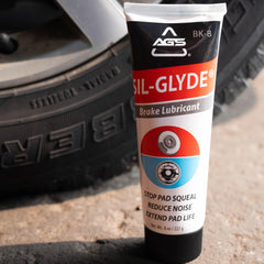 AGS SIL-Glyde applied to caliper slide showing quieting and protection