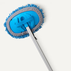 Amazon Basics extended handle beside a person showing 62-inch reach for washing roofs