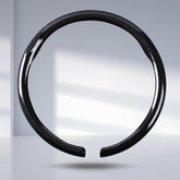 Aotoyou steering wheel cover front view showing glossy carbon finish and sleek look
