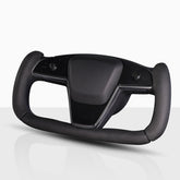 Aotoyou front view on Tesla yoke showing sleek black fit and improved control