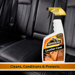 Armor All being applied to a leather car seat restoring softness and look