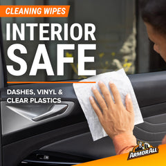 Hand using Armor All wipe on dashboard for fast dirt and dust removal