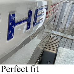 Auto safety installed on truck tailgate in driveway showing quick visual upgrade