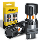 AUXITO 3157 pack front view showing bulb pair and amber output benefit