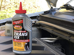 Bar's Leaks bottle placed in car engine bay demonstrating how and where to add treatment safely
