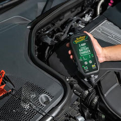 Battery Tender installed in a vehicle trunk, brand and convenient in-car placement benefit