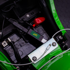 Battery Tender close-up of USB port with dust cover, protects port from dirt and moisture