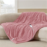 Bedsure heated throw front view shows pink ribbed design and cozy look