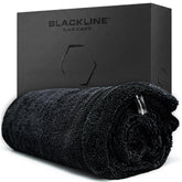 Blackline front view of towel folded showing size and label, clear sizing benefit