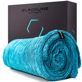 Blackline front view of drying towel showing full 24x36 size and quick drying benefit