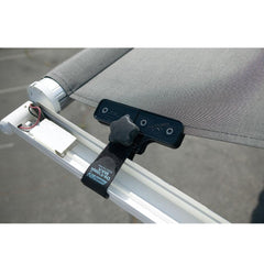 Camco clamp installed on RV awning in use reducing wind noise and flapping