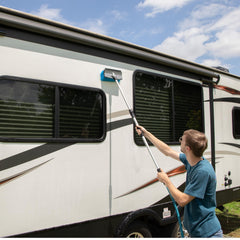 Camco telescoping handle extended demonstrating reach benefit for high areas