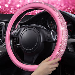 CAR PASS steering wheel closeup displaying rhinestones and improved grip.