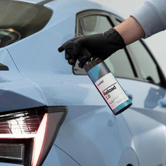 CARPRO Reload being wiped with a microfiber demonstrating smooth application and buffing