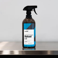 CARPRO Reload close-up on glossy paint reflecting light to show enhanced shine benefit