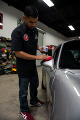 Chemical Guys buffed panel revealing deep wet gloss and enhanced light reflection