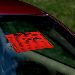 Crtiin sticker placed on windshield signaling violation clearly