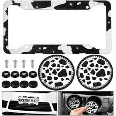DaisyInner license plate frame front view showing rhinestones and cow print for stylish curb appeal