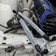 Design Engineering installed in engine bay protecting hoses from heat and debris
