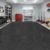 DOLZO full-size garage mat laid out protecting concrete floor