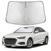 EcoNour front view sunshade fitted on Audi A4 showing full windshield coverage and protection