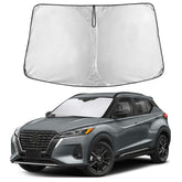 EcoNour sunshade front fit on Nissan Kicks showing full windshield coverage and cooler cabin benefit