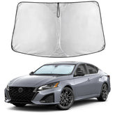 EcoNour front view installed on Altima windshield showing full coverage benefit