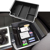EDBETOS front view of console tray showing organized storage and quick access