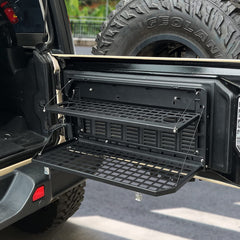 EOIS tailgate table lower shelf holding tools and gear for organized storage