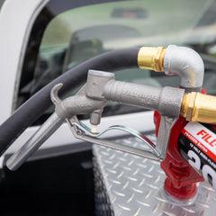 Fill-Rite FRHMN100S hung on pump hook for tidy storage and reduced wear