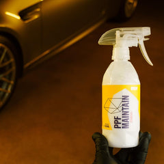 Gyeon-treated car panel before and after demonstrating improved water beading