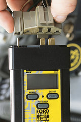 Innova 3145 connector close-up plugging into Ford diagnostic port for instant access