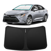 INSAUTO front-fitting shade on Toyota Corolla windshield showing snug coverage and protection