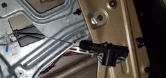 InstallGear actuator installed in a car door showing reliable lock operation benefit