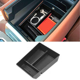Jaronx front view of console tray fitting perfectly, keeps items organized