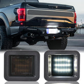 KanSmart front view of license plate light showing clean smoked lens and fit