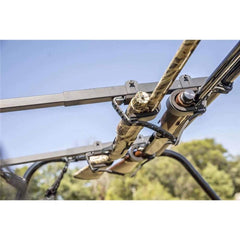 Kolpin installed overhead rack inside UTV cab holding two rifles for safe transport