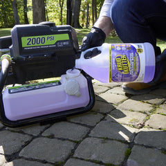 Krud Kutter being sprayed from a pressure washer on patio, speeds cleaning