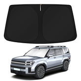 KUST front view showing custom-fit sunshade on Santa Fe windshield protecting interior