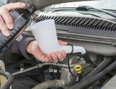 Lisle funnel in use adding brake fluid to master cylinder reducing spills and mess