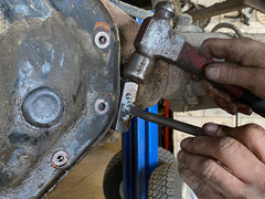 Lisle separator in use on differential cover demonstrating controlled gasket removal benefit