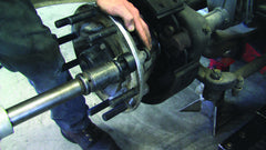 Lisle tool in use pulling a truck wheel stud with an impact wrench