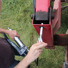 LockNLube coupler attached to a Zerk fitting delivering clean grease flow