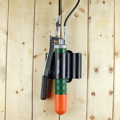 LockNLube holder mounted on truck bed illustrating secure vibration-resistant storage