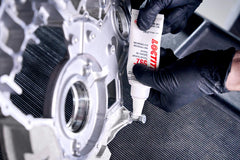 Loctite 592 beside a ruler showing 50 ml tube scale for accurate size expectation