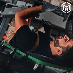 M-AUTO in flat lay-down position providing padded support for undercar work