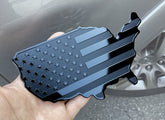 MULL emblem front view showing glossy and matte black finish for sleek styling