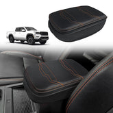 Muslogy front view of armrest cover showing fit and orange stitch detail, adds style